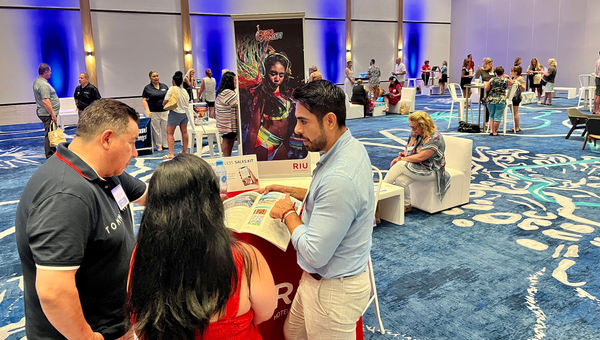 Jonathan Onofre (right), a business development manager for Riu Hotels & Resorts, speaks with travel advisors at the Pleasant Holidays Elite Experience retreat. Jonathan Onofre (right), a business development manager for Riu Hotels & Resorts, speaks with travel advisors at the Pleasant Holidays Elite Experience retreat.