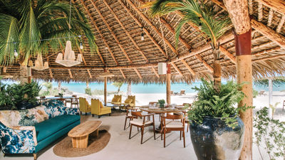 Barefoot chic Sugarcane is a gathering spot for cocktails, canapes and conversation on Kamalame Cay.