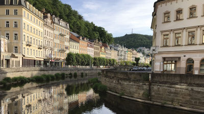 Buildings in Karlovy Vary reflected in the Tepla River, which runs through the middle of the city.