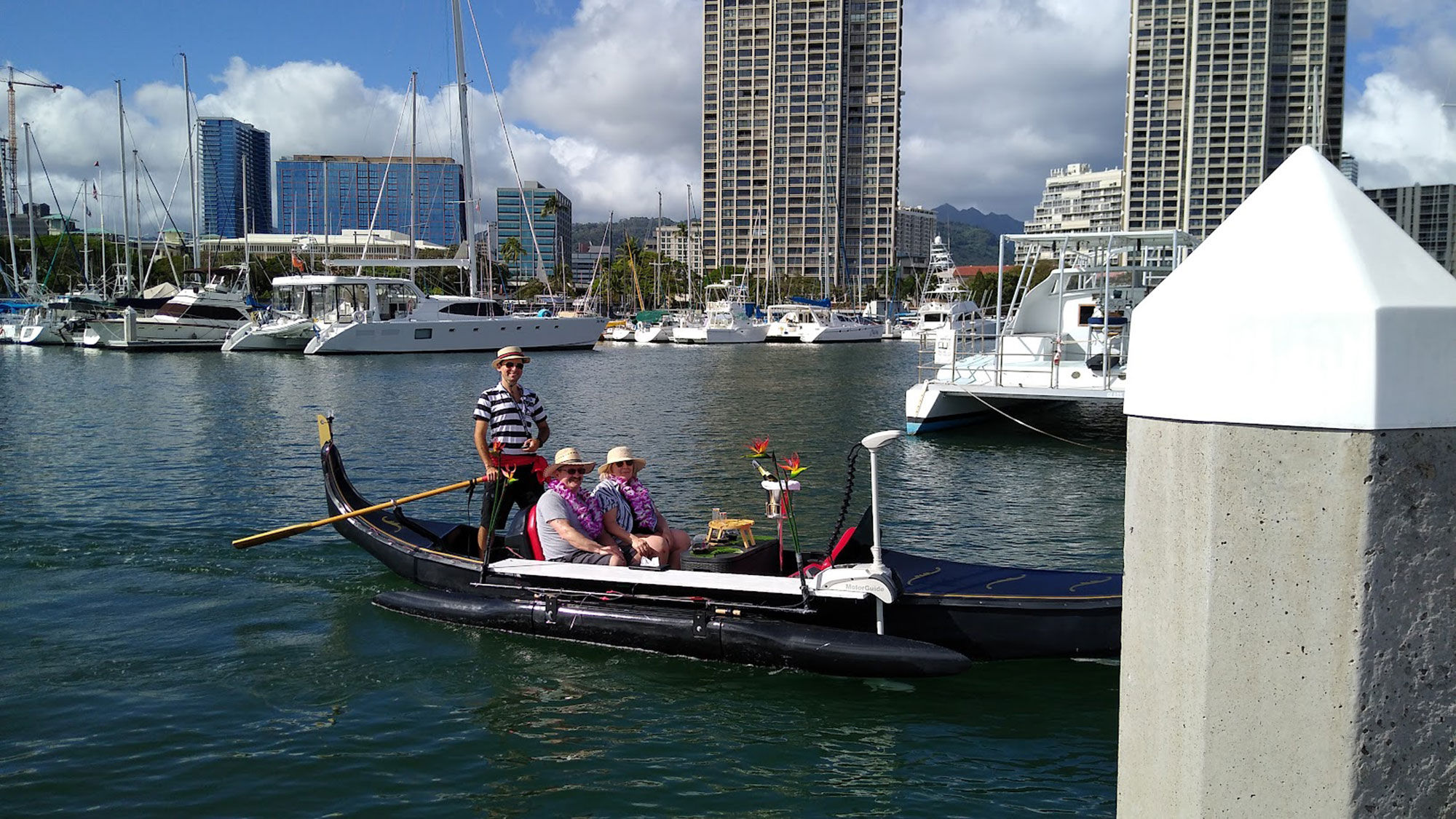 The Ala Wai Canal gondola tour takes guests on a calm cruise under three bridges.