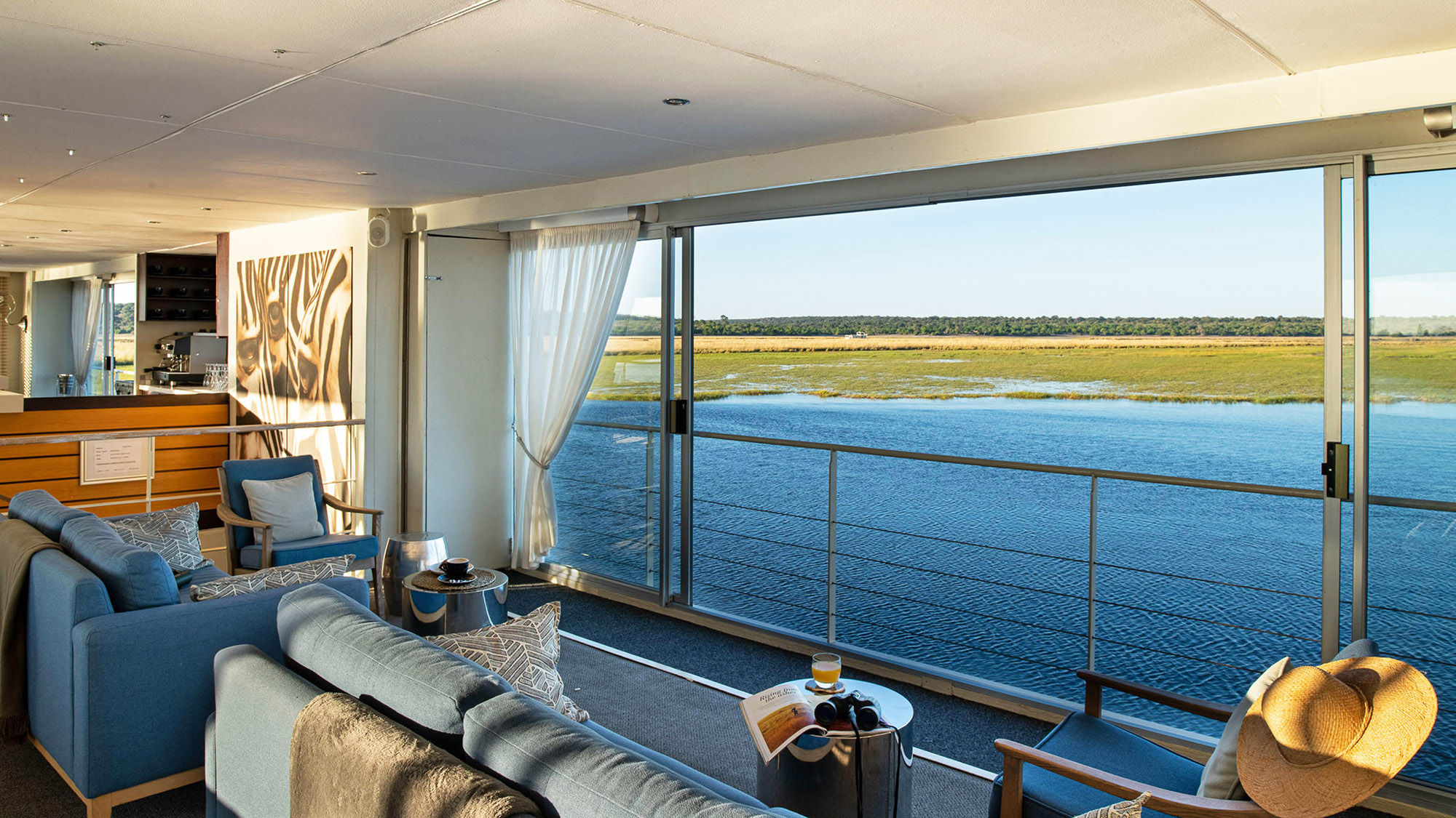The lounge on the 28-passenger Zambezi Queen. Sailings offer views of the Caprivi Strip on one side and Chobe National Park on the other.