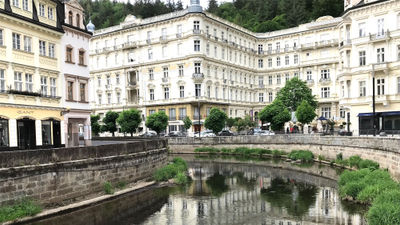 Grandhotel Pupp reflected in the Tepla River.