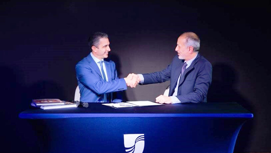 Seabourn president Josh Leibowitz (left) and T. Mariotti managing director Marco Ghiglione sign documents to complete the delivery of Seabourn Venture.