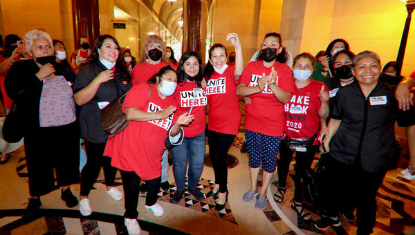 Unite Here Local 11 members react following the Los Angeles City Council's approval of the Hotel Worker Protection Initiative.
