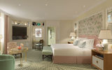 An English garden-inspired guestroom in pale green.