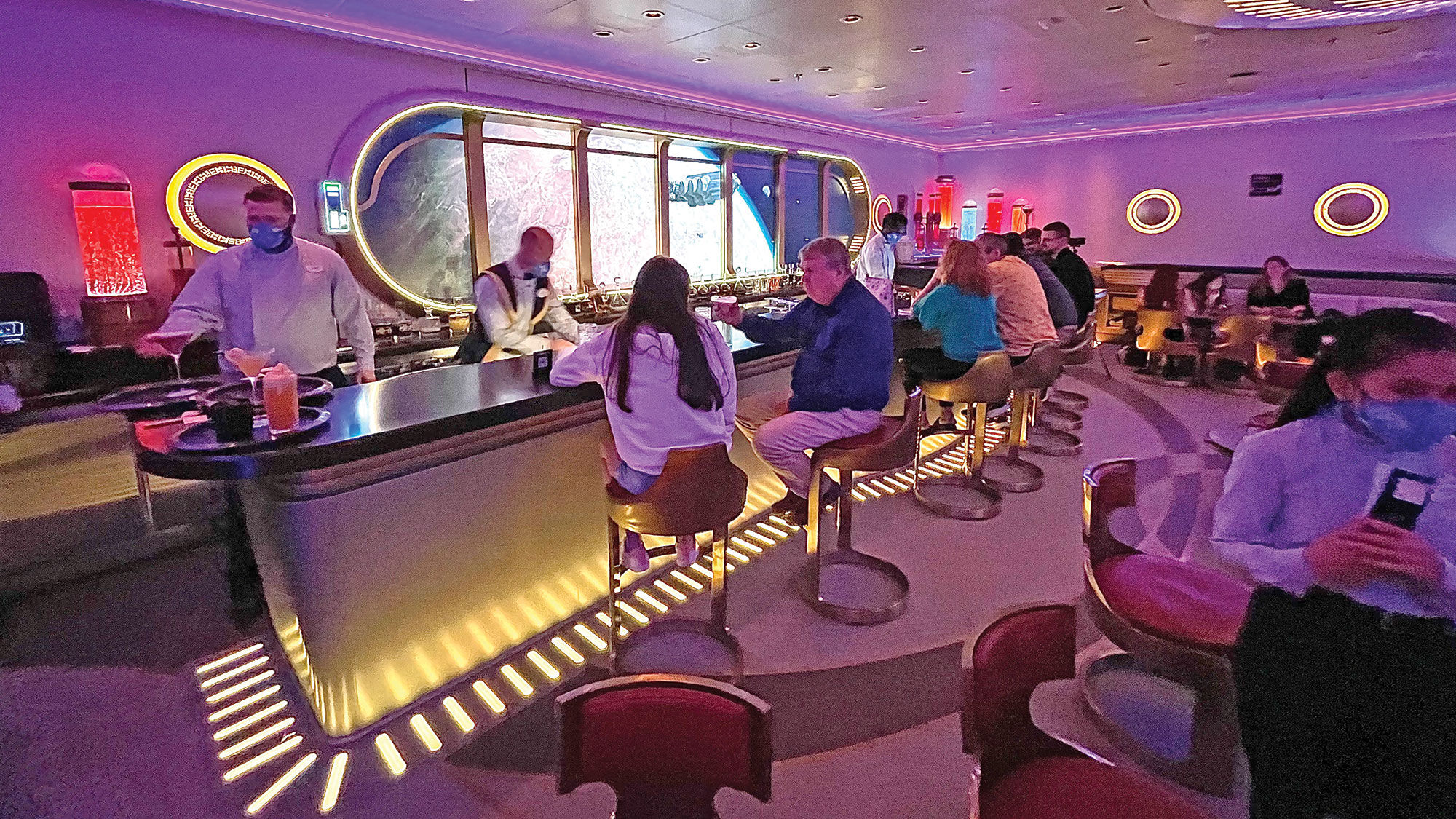 The adults-only Star Wars: Hyperspace Lounge has a  “window” behind the bar that offers views of planets and ships from the Star Wars universe.