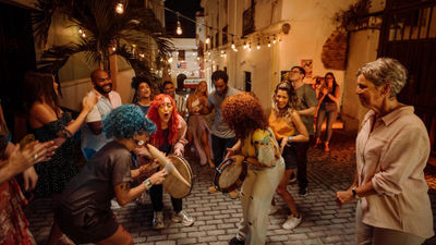 Street dancing in Puerto Rico is a favorite activity of locals and visitors and one way that visitors can 'Live Boricua.'