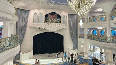 The Grand Hall on the Disney Wish has a stage for performances and character appearances.