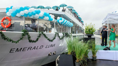 Emerald Luna godmother Vanessa McGovern breaking a bottle of champagne over the hull.