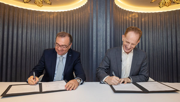 Luigi Matarazzo (left), general manager of Fincantieri's Merchant Ships division, and Norwegian Cruise Line CEO Harry Sommer sign off on the Norwegian Prima delivery.
