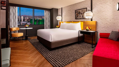 The remodeled king room at New York-New York on the Strip features bold splashes of red and yellow.