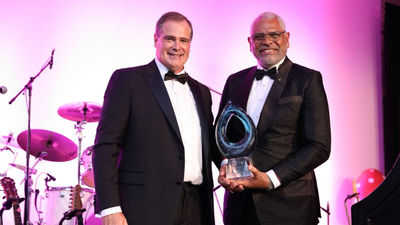 ASTA president and CEO Zane Kerby, left, awarded Carnival Corp. vice chair Arnold Donald with a Lifetime Achievement Award. Carnival Corp. donated $100,000 to the Society, part of a record-breaking $375,000 raised during this year’s Global Convention.