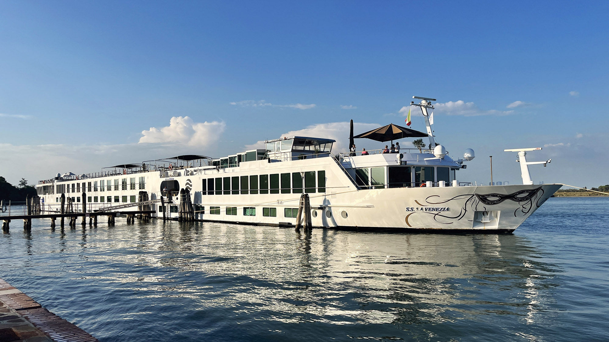 Uniworld's S.S. La Venezia docked in Burano, Italy, a small and colorful island located in the Venetian Lagoon.