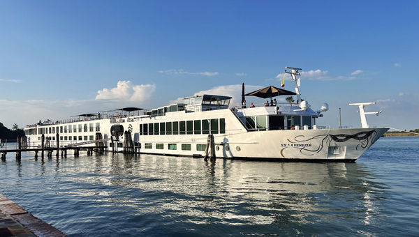 Uniworld's S.S. La Venezia docked in Burano, Italy, a small and colorful island located in the Venetian Lagoon.