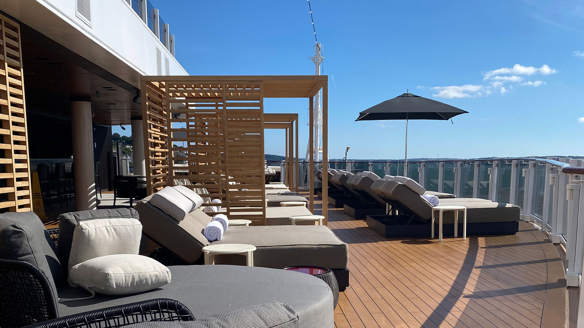 The deck of the Haven includes large day beds and an infinity pool that looks off the aft of the ship.