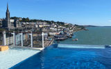 On the Norwegian Prima, The Haven's infinity pool offers a view off the aft of the ship in Cobh, Ireland.