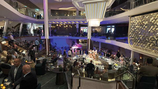 The scene at the Martini Bar in the Grand Plaza, where servers tossed bottles and shakers as they mixed drinks.