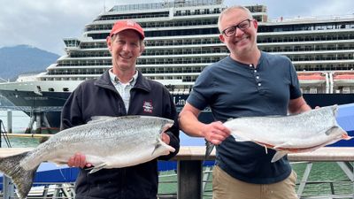 Holland America Line chef Ethan Stowell (right) with an Alaska fisherman.