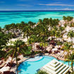 The pool area and palm-lined beach at the Aruba Marriott Resort & Stellaris Casino.