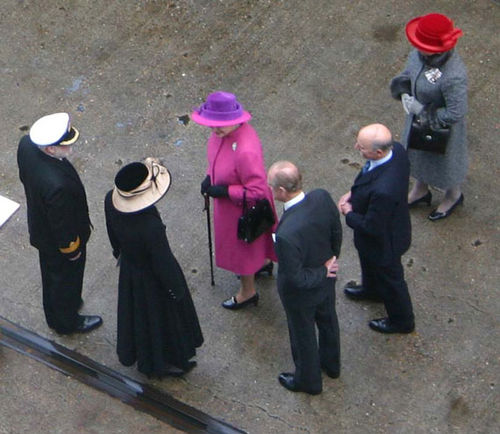 Queen Elizabeth II, center, greeting Cunard president Pamela Conover. At Cover's left is Capt. Ronald Warwick; to her right is Prince Philip. Queen Elizabeth II, center, greeting Cunard president Pamela Conover. At Cover's left is Capt. Ronald Warwick; to her right is Prince Philip.