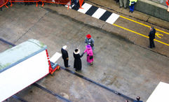 Queen Elizabeth II shakes hands with Pamela Conover, then president of Cunard, at the gangway to the Queen Mary 2 during its inaugural festivities in 2004. The Queen was the ship's godmother.