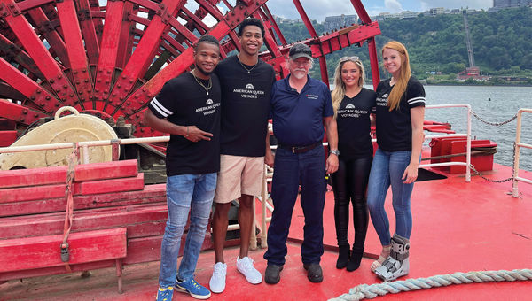 An American Queen Voyages job-promotion photo with Pittsburgh student-athletes. An American Queen Voyages job-promotion photo with Pittsburgh student-athletes.