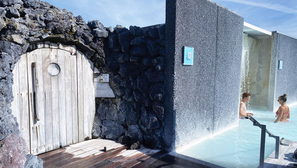 Next to an in-pool shower, a rounded door built into a mound of lava rock leads to a wet sauna. Next to an in-pool shower, a rounded door built into a mound of lava rock leads to a wet sauna.