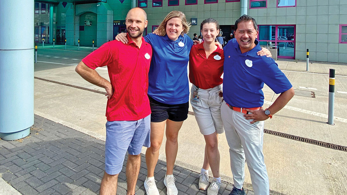 Adventures by Disney Adventure Guides, from left, George, Michaela, Emma and Dean pose for a picture and keep up spirits on a rest stop on the Austria-Slovakia border.