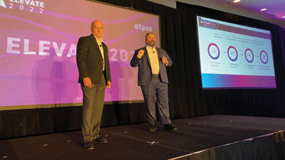 ATPCO CEO Alex Zoghlin, right, and chief strategy officer Tom Gregorson on stage in Arlington, Va.
