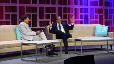 Norwegian Cruise Line Holdings chief Frank Del Rio with Travel Weekly editor in chief Arnie Weissmann, left, at CruiseWorld.