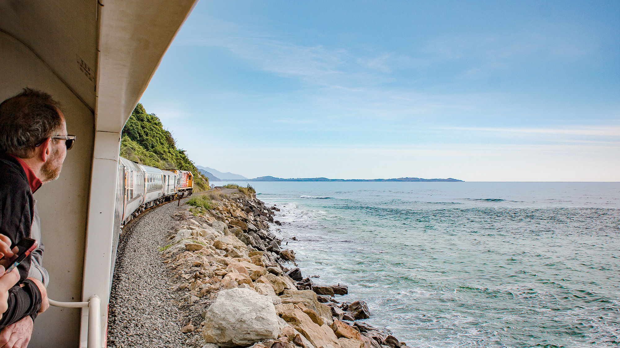 The Coastal Pacific creeps around the cliffs of Oaro on its way to Kaikoura, New Zealand.