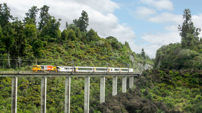 Great Journeys New Zealand is operating tours along KiwiRail's three scenic train services. One of those, the Northern Explorer train, is seen here heading south across the Hapuawhenua Viaduct within Tongariro National Park in New Zealand.