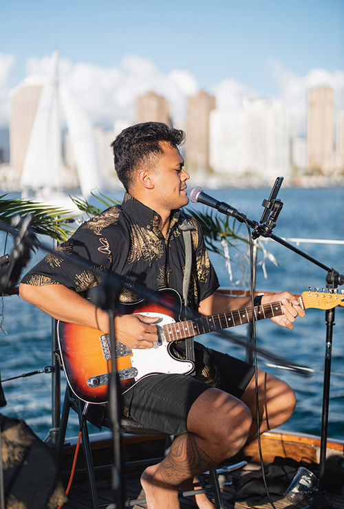 Live music is a popular part of the Vida Mia's sunset cruise. Dillon Pakele, pictured here, performs regularly.