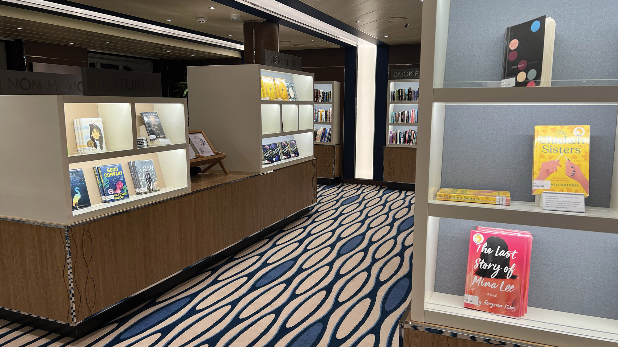 The large library onboard the Rotterdam is brightly lit and resembles a bookstore.