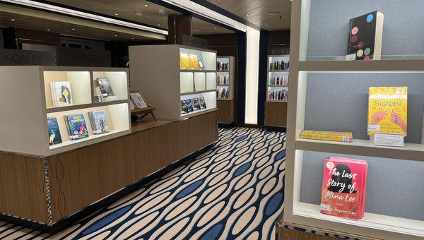 The large library onboard the Rotterdam is brightly lit and resembles a bookstore. The large library onboard the Rotterdam is brightly lit and resembles a bookstore.