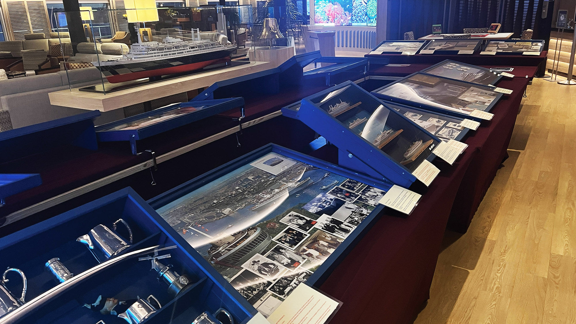 A collection of historical artifacts from Holland America Line in the Crow's Nest lounge aboard the Rotterdam.