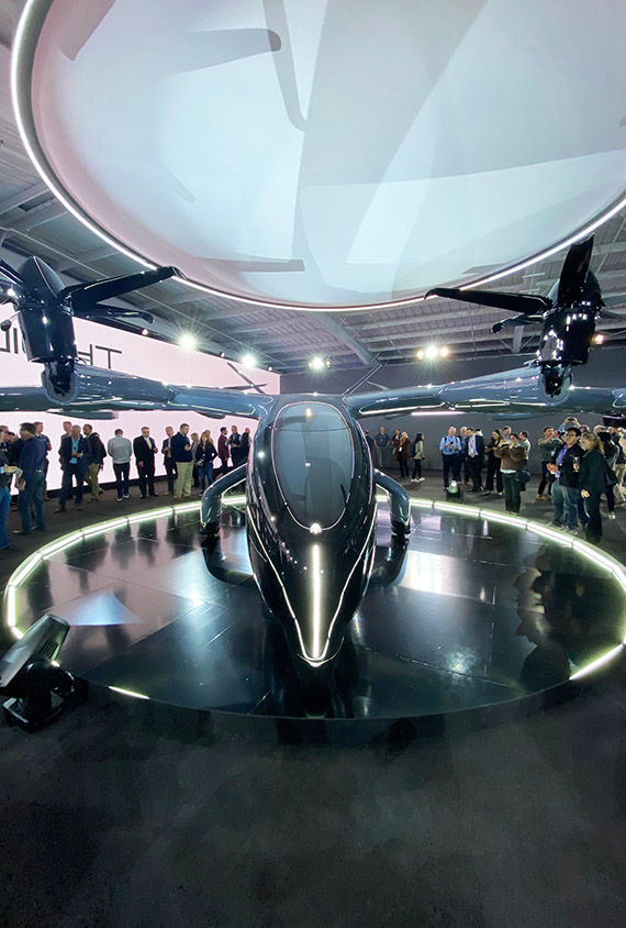 Invited guests check out the Archer Midnight during an unveiling event Wednesday evening in a hangar at Palo Alto airport.