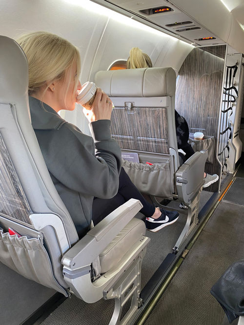 JSX flyer Rachel Marrow relaxes aboard a flight from Phoenix to Denver. JSX flyer Rachel Marrow relaxes aboard a flight from Phoenix to Denver.