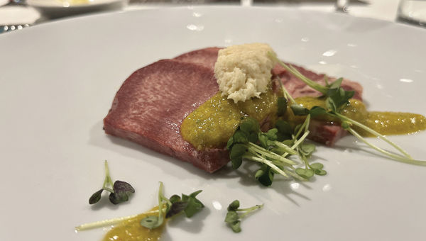 A beef tounge appetizer, prepared onboard the ship.