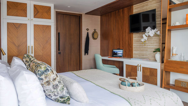 A stateroom on the Kontiki Wayra. Designer Soledad Calderon decorated the cabins in alpaca throws, pottery and natural wood in a style she calls "rustic elegance." A stateroom on the Kontiki Wayra. Designer Soledad Calderon decorated the cabins in alpaca throws, pottery and natural wood in a style she calls "rustic elegance."