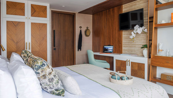 A stateroom on the Kontiki Wayra. Designer Soledad Calderon decorated the cabins in alpaca throws, pottery and natural wood in a style she calls "rustic elegance."