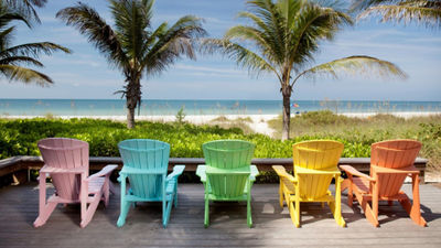 Colorful chairs overlooking the beach on Santa Maria Island. The destination survived Hurricane Ian intact.