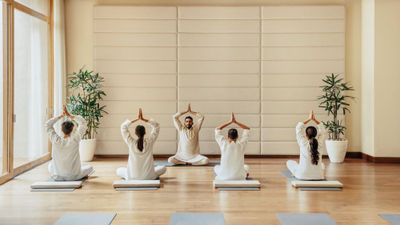 Guests at the Six Senses Vana practice yoga.