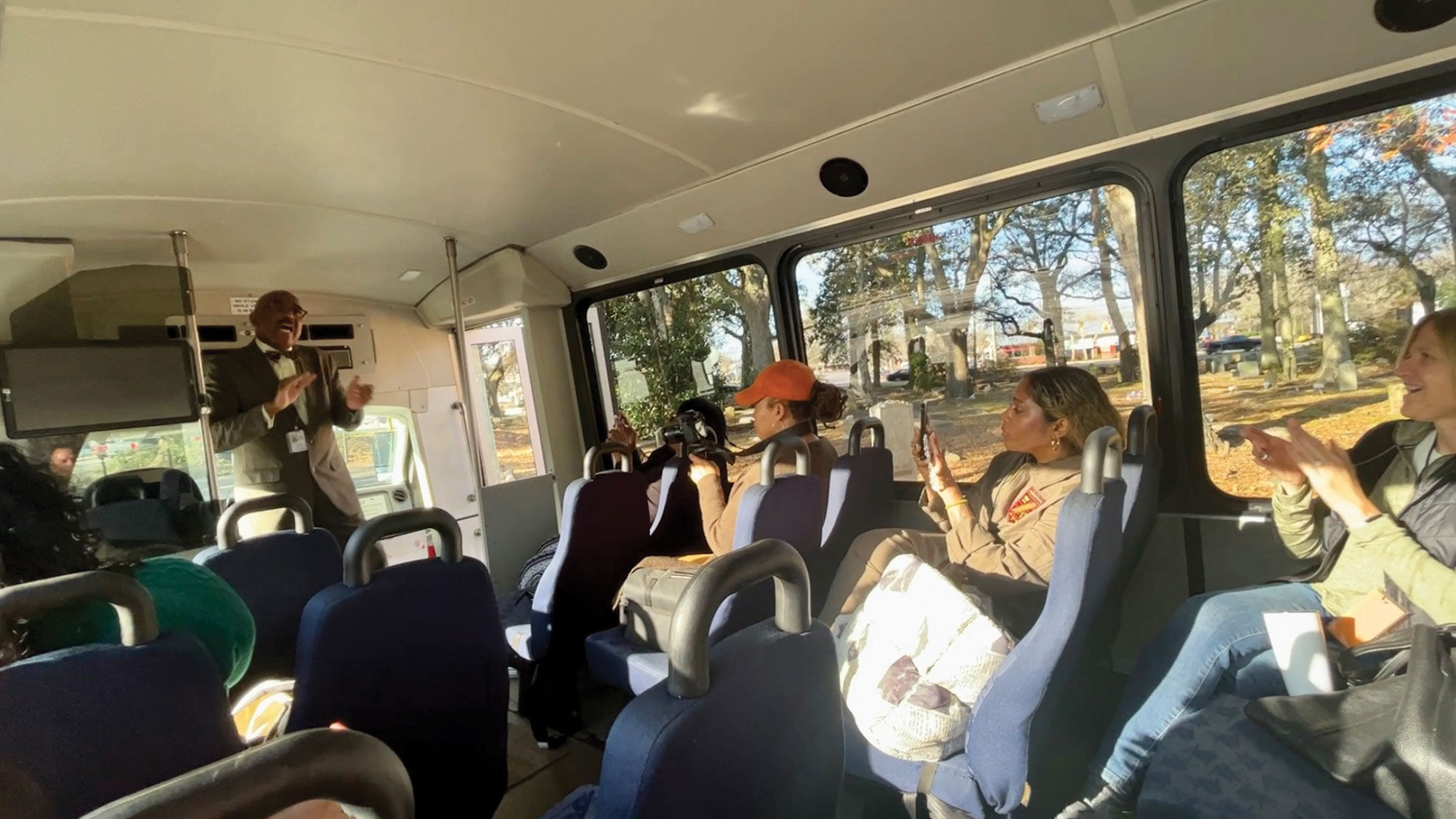 Al Harris, owner of Sites and Insights Tours, teaches his tour group the rhythms and songs of the Gullah Geechee.