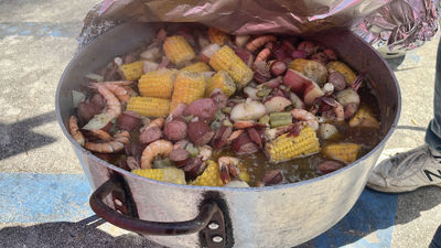 Lowcountry boil cooking over an outdoor fire in traditional Gullah Geechee style during a Black Cultural Heritage Tours trip.
