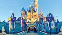 Sleeping Beauty Castle in Disneyland park is decked out in honor of the Disney100 celebration.