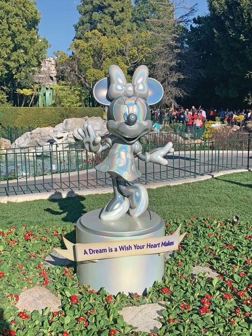 A statue of Minnie Mouse was unveiled in the Disneyland park as part of the Disney100 celebration.