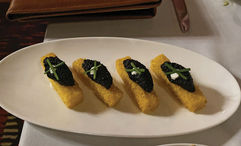 Black caviar adds a buttery sensation to the polenta sticks appetizer at Allie's Cabin.
