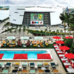 The pool area at the CitizenM Miami Worldcenter with American Airlines Arena in the background.