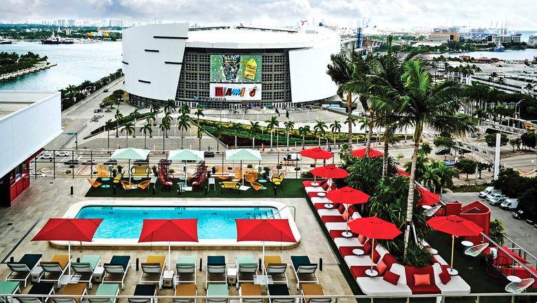 The pool area at the CitizenM Miami Worldcenter with American Airlines Arena in the background.
